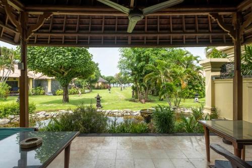 a view of a park from the patio of a house at Taman Sari Bali Resort and Spa in Pemuteran