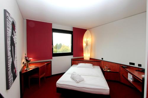Postel nebo postele na pokoji v ubytování Ara Hotel Comfort