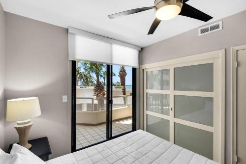 a bedroom with a bed and a ceiling fan at East Pass 101 in Destin