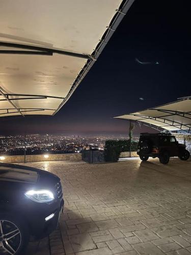 a car parked under a building at night at Apartment in Tirana with view in Tirana