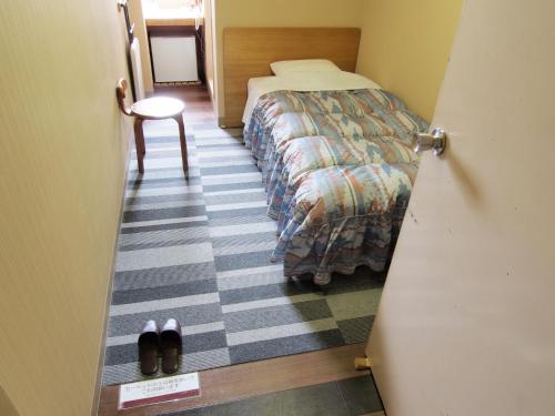 Posteľ alebo postele v izbe v ubytovaní Tsukuba Daily Inn