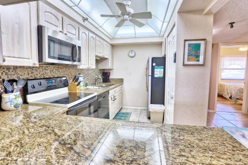 a kitchen with marble counter tops and a ceiling at Villa Madeira 506 - Premier in St Pete Beach