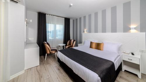 Кровать или кровати в номере Motto Premium Hotel&Spa