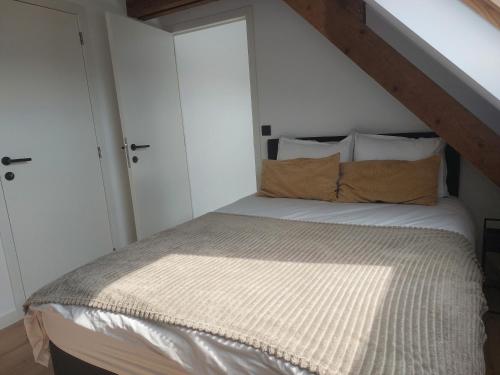 Appartement in Ekeren (Antwerpen)にあるベッド