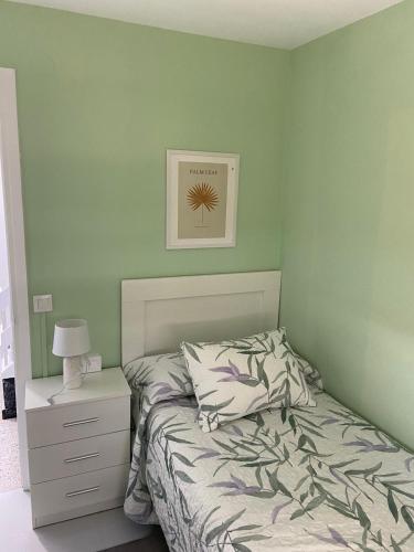 a bedroom with a bed and a picture on the wall at VT Maria in Ribadeo