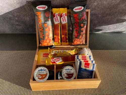 a wooden box filled with different types of snacks at Jahorina Luxury Chalets in Jahorina