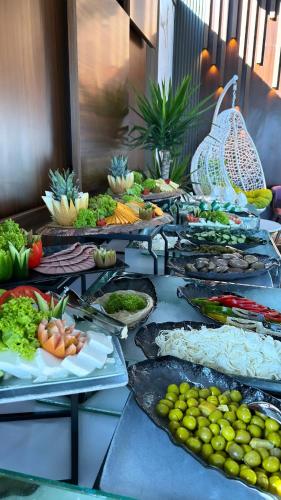 a buffet line with many different types of food at Swiss International Taif in Taif