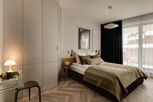 Posteľ alebo postele v izbe v ubytovaní Sage Apartment