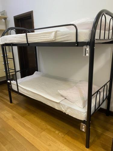 a couple of bunk beds in a room at KLCC View by Regalia Dorms in Kuala Lumpur