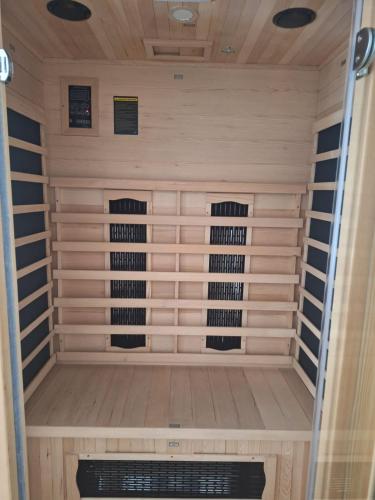a sauna with three racks of wine bottles at BED e SUITE DOMAR in Brindisi
