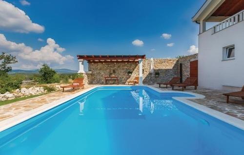 a villa with a swimming pool and a house at Villa Ivy mit perfekter Privatsphäre, Pool, Sauna, Jacuzzi in Opanci
