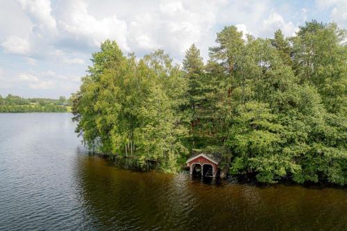 a small house in the middle of a lake at Ahoniemi - Kellankoski in Rossi