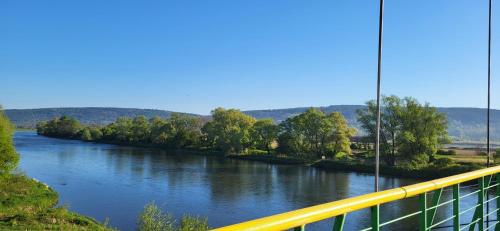 a view of a river from a bridge at Domek w Dolinie Sanu in Witryłów