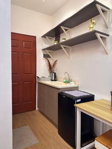 a kitchen with a sink and a counter top at CONDO IN LAPU LAPU NEAR AIRPORT in Lapu Lapu City