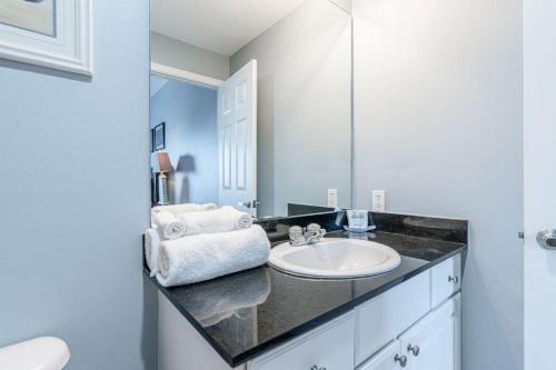 a bathroom with a sink and a mirror at San Carlos 907 in Gulf Shores