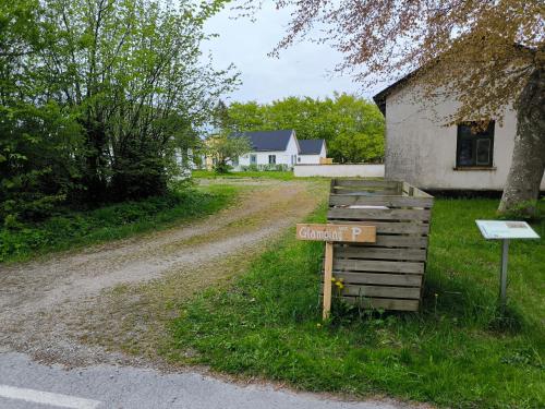 a street sign on the side of a dirt road at Luxury Tent with Restroom and shower, close to the Beach in Ystad