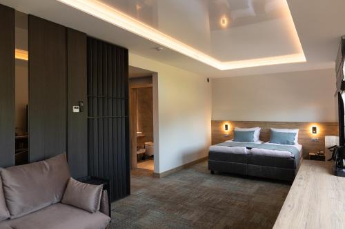 Postel nebo postele na pokoji v ubytování Molėtai Hotel