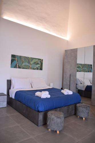 Postel nebo postele na pokoji v ubytování Arco Pirone Holiday House - A un passo dal Vesuvio