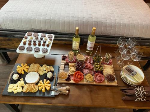 a table full of food and wine glasses and wine bottles at Cartier Mansion in Ludington