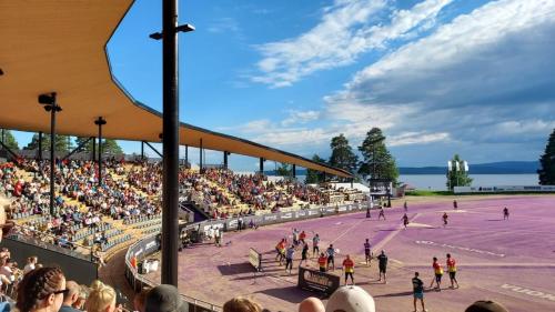 a crowd of people watching a tennis match on a court at Lomayksiö C 3 Sotkamon keskustassa in Sotkamo