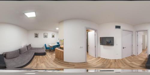 a living room with a couch and a table at Apartman Mina 4 in Vrdnik