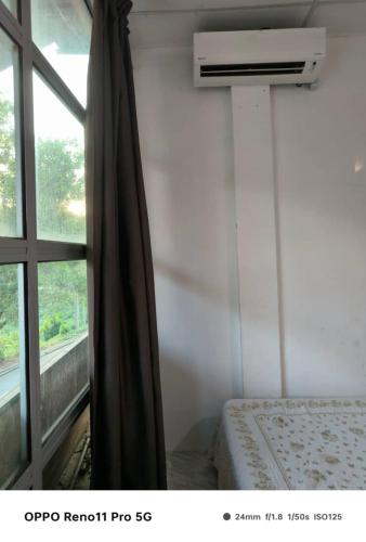 Ένα ή περισσότερα κρεβάτια σε δωμάτιο στο NaVita Lodge