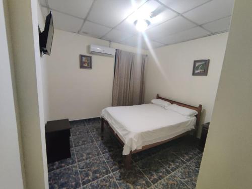 Tempat tidur dalam kamar di hotel plaza mirage ch