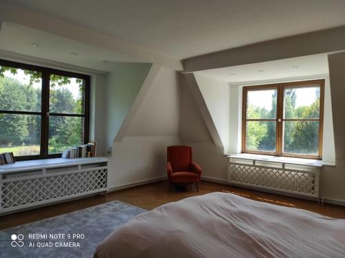 Ένα ή περισσότερα κρεβάτια σε δωμάτιο στο Ancien Château de Pecq
