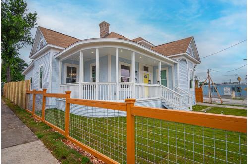 a white house with a fence in front of it at Trendy Historical Home Near Downtown Attractions in San Antonio