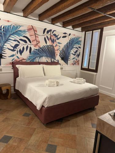 Voodi või voodid majutusasutuse Locanda Ca' Leon - Ferretti Hotels Collection toas