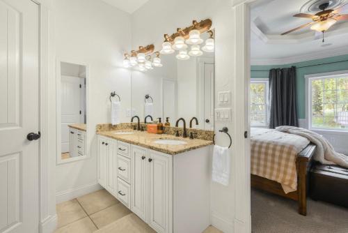 a bathroom with a sink and a mirror at The Victorian off Main Street in Ouray