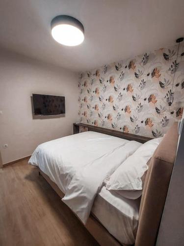 Postel nebo postele na pokoji v ubytování Iris Apartment Livadeia
