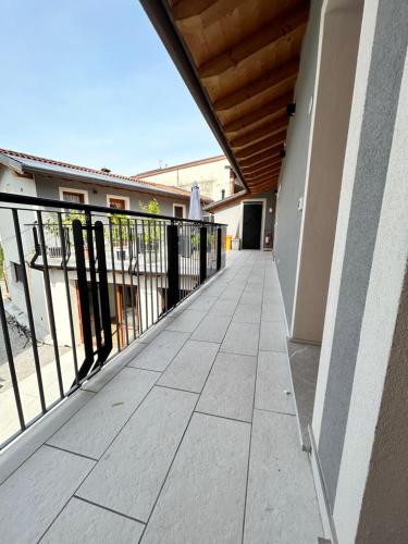 a balcony of a building with a black railing at Locanda B&B Da Nati in Arba