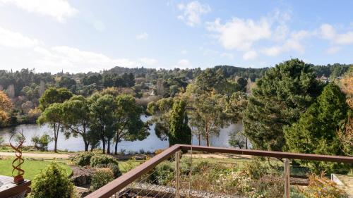 a view of a lake from the balcony of a house at Balconies Lakeview Apartment in Daylesford