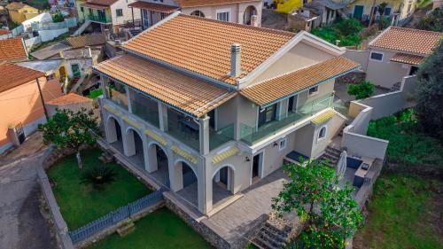 an overhead view of a house with a roof at Carpe Diem Moursia Studio in Liapades