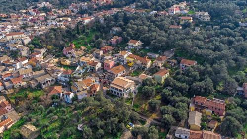 an overhead view of a town with houses and trees at Carpe Diem Moursia Studio in Liapades