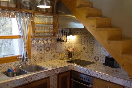 a kitchen with a sink and a counter top at Kouklospito Agios Polykarpos in Raches