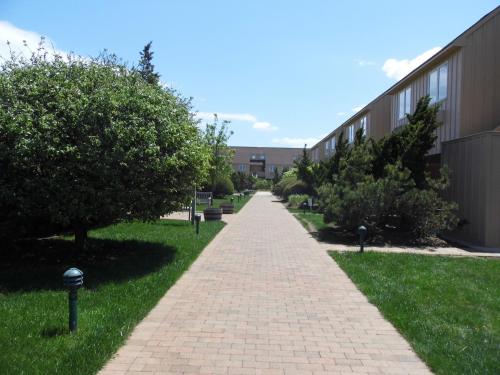 a brick walkway in front of a building at Windward Shores in Amagansett