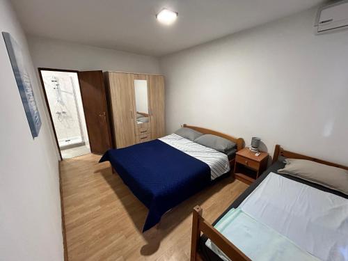 Кровать или кровати в номере Apartments Branko