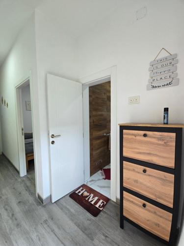 a room with a bedroom with a dresser and a closet at Riverstone Retreat Villa in Jajce