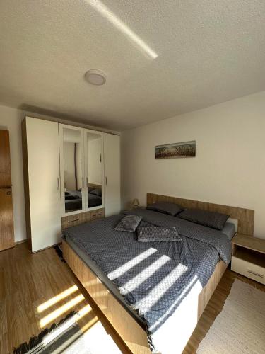 a bedroom with a large bed in a room at Riverstone Retreat Villa in Jajce
