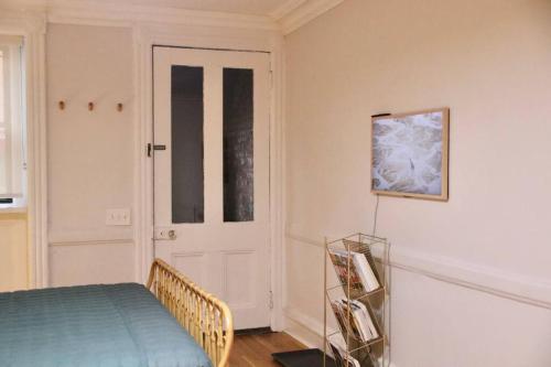 a room with a bed and a door with a window at Cosy apartment in Cobble Hill in Brooklyn