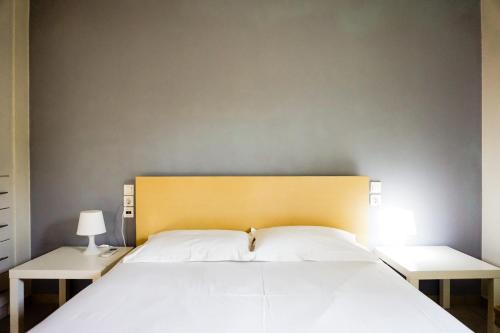 Un pat sau paturi într-o cameră la Villa Marilyn 14-16