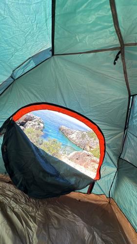 a view from inside of a tent with a window at Camping Aquarium in Himare