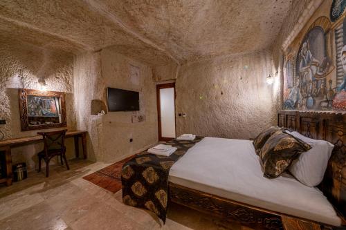 Télévision ou salle de divertissement dans l'établissement Capp Royal Cave HOTEL