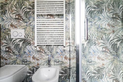 a bathroom with a toilet and a sink at Ca' Nadin Agriturismo in San Damiano dʼAsti