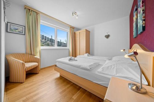 Gulta vai gultas numurā naktsmītnē Apartment Tauernblick Top3 by Four Seasons Apartments