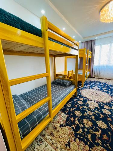 a bedroom with two bunk beds in a room at Windhorse Tours and Hostel in Ulaanbaatar