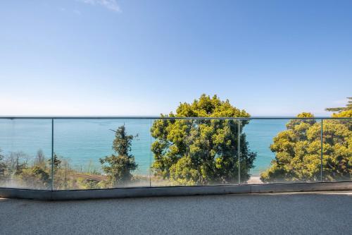 a view of the ocean from a balcony at Green Cape Botanico in Batumi