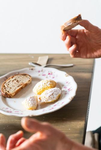 a person eating a plate of eggs and toast at Ca' Nadin Agriturismo in San Damiano dʼAsti